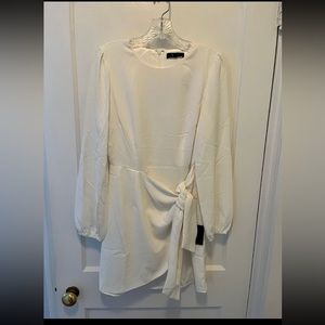 Long sleeve, white dress. Great for winter bridal shower!